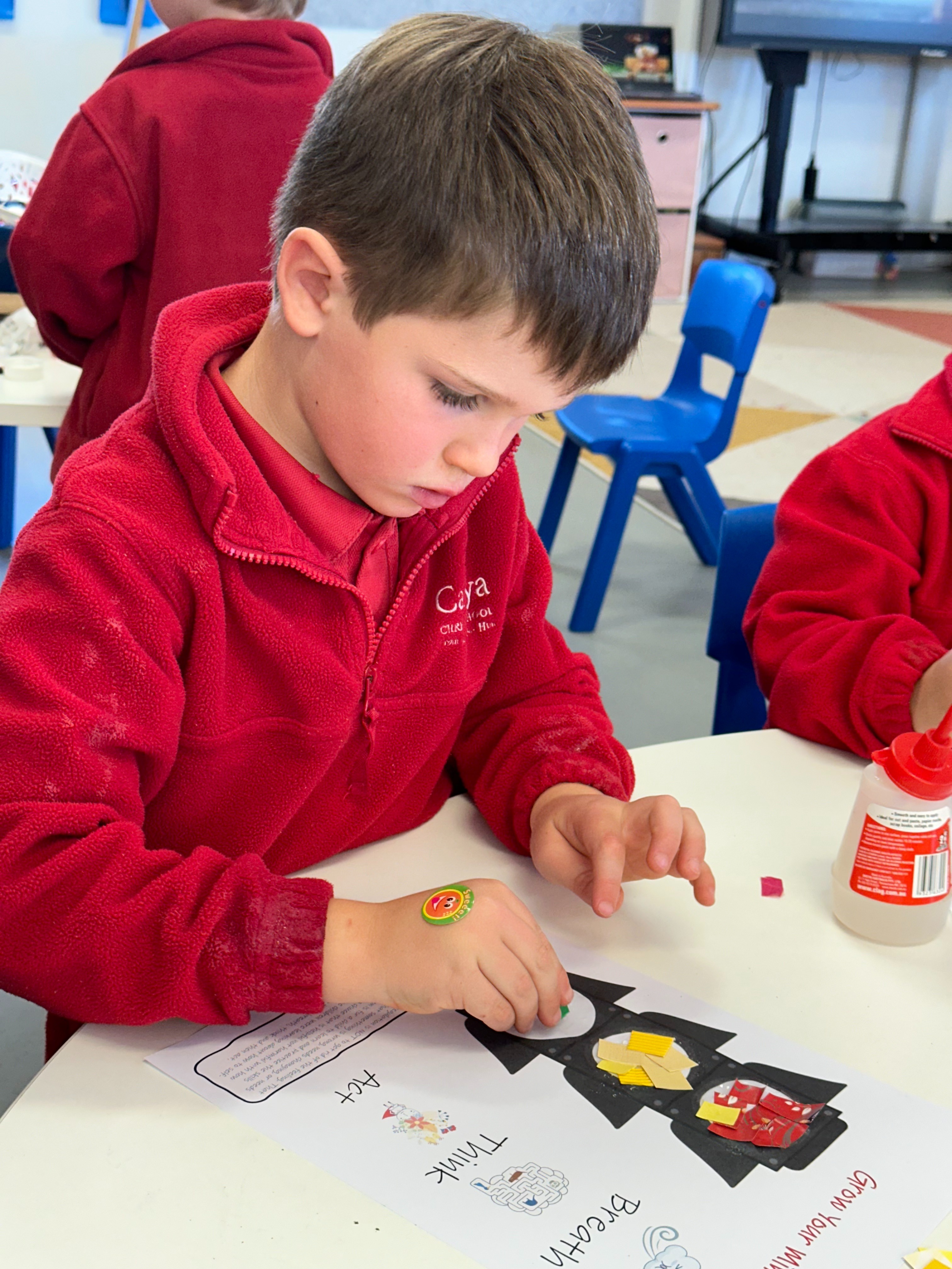 A student in deep thought during a classroom activity